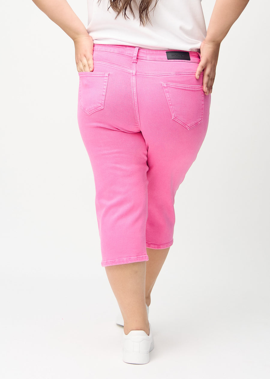 Light pink regular capris seen from the back on a plus-size model, so the entire product can be seen.