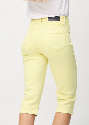 Light yellow regular capris seen from the back close up to show details.