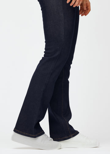 Deep dark blue denim jeans for women in the color Midnights with a bootcut fit seen in close-up at the ankles to show the slight flare.