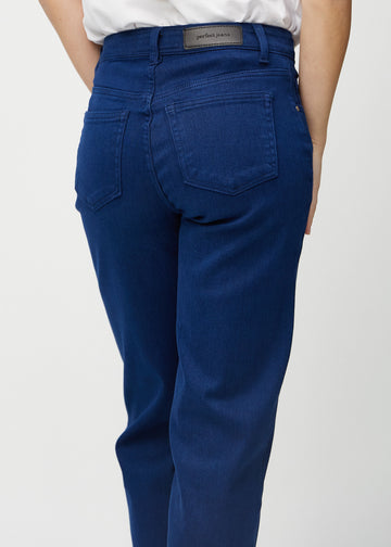 Dark blue loose jeans seen from the back close up to show details.