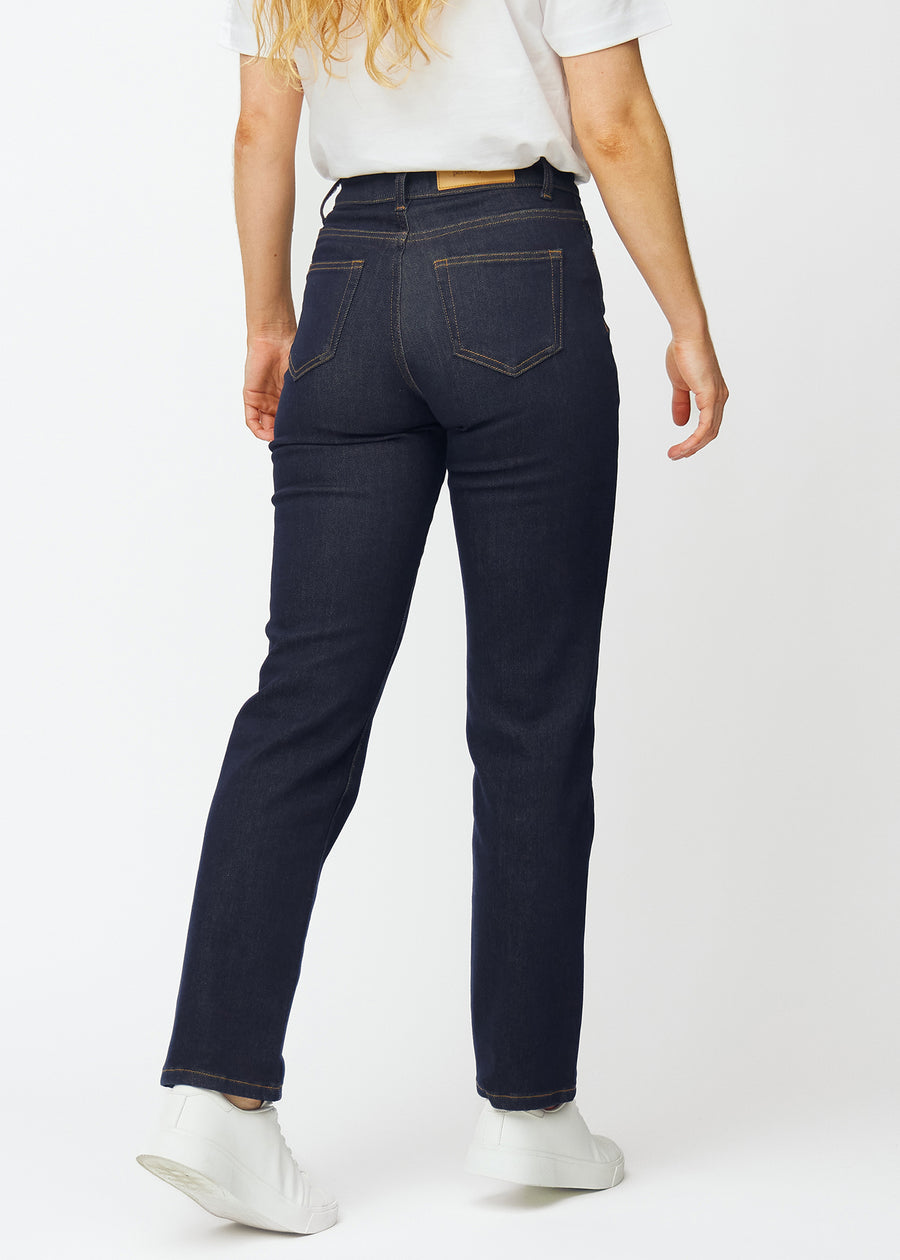 Deep dark blue denim jeans for women in the color Midnights, seen from the back.