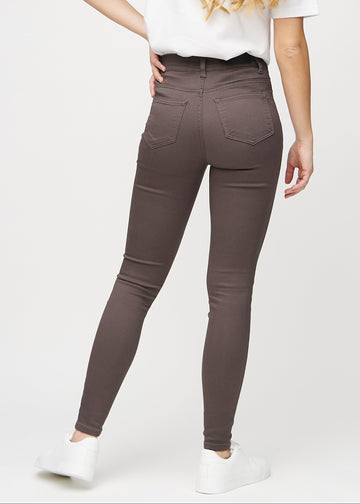 Grey-brown skinny jeans seen from the back, so the full product can be seen.