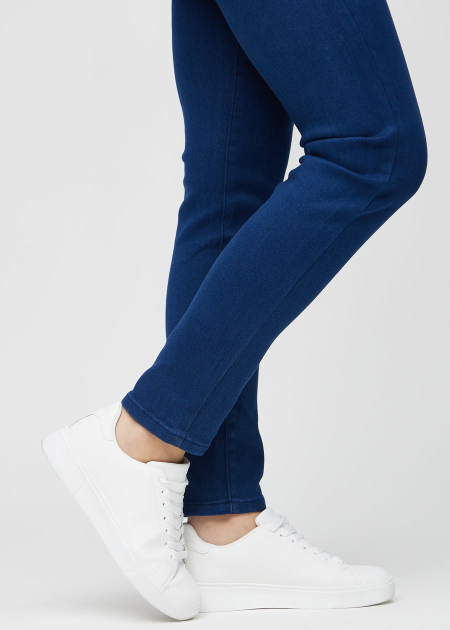 The ankles of a model, so you can see how tightly the jeans fit.