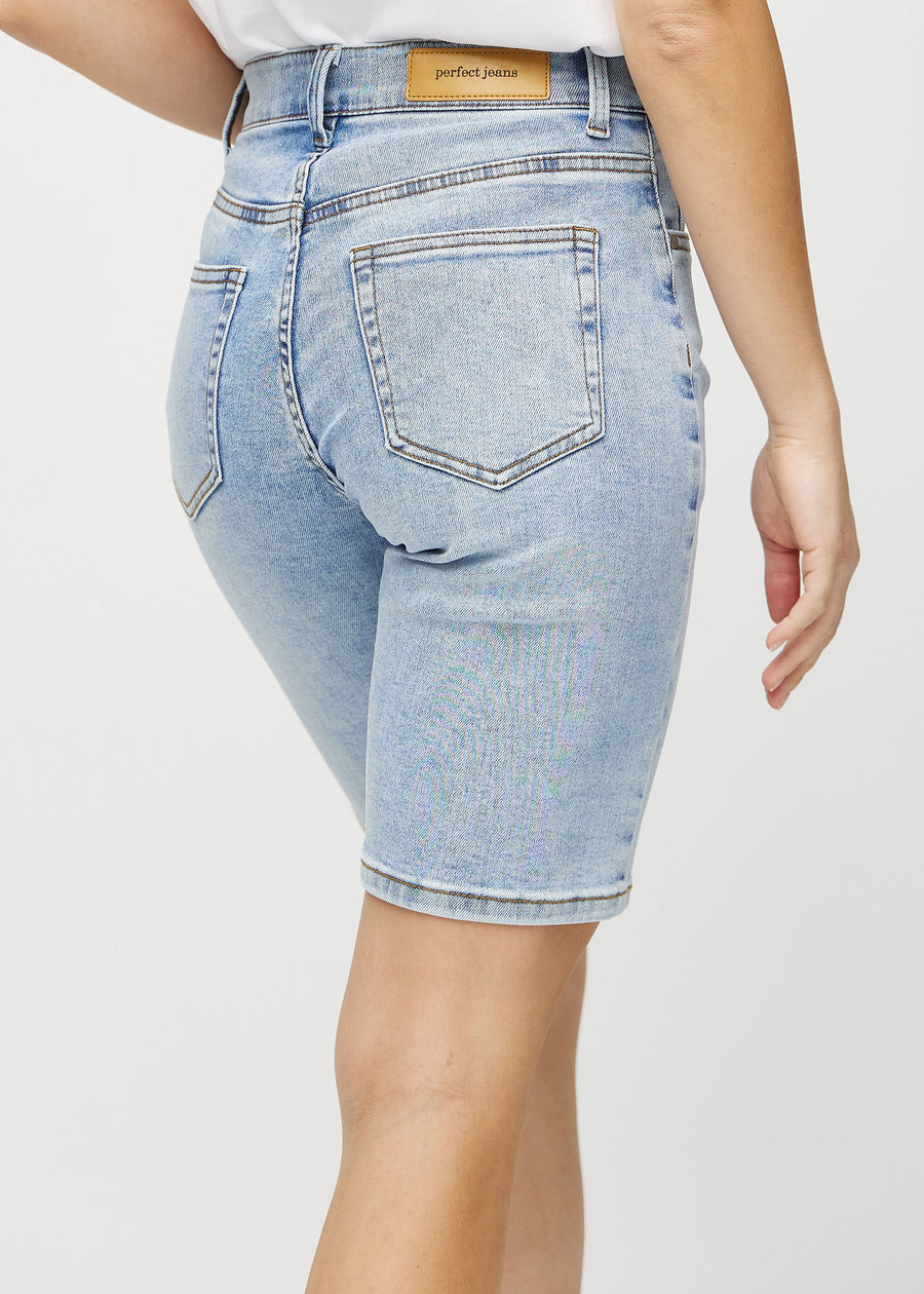 Light denim regular middle shorts seen from the back close up to show details.