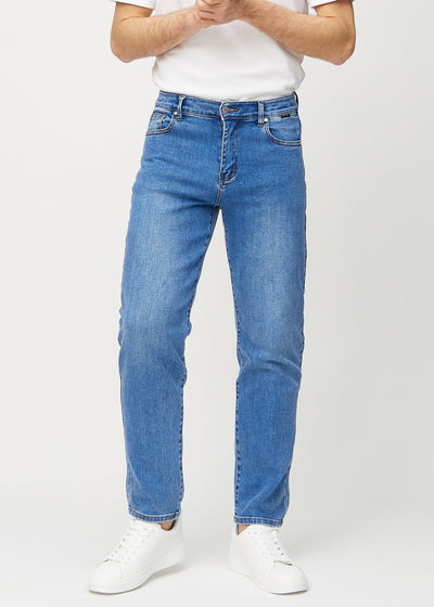 Denim regular jeans, model name Rivers, which runs straight down the leg, seen from the front.