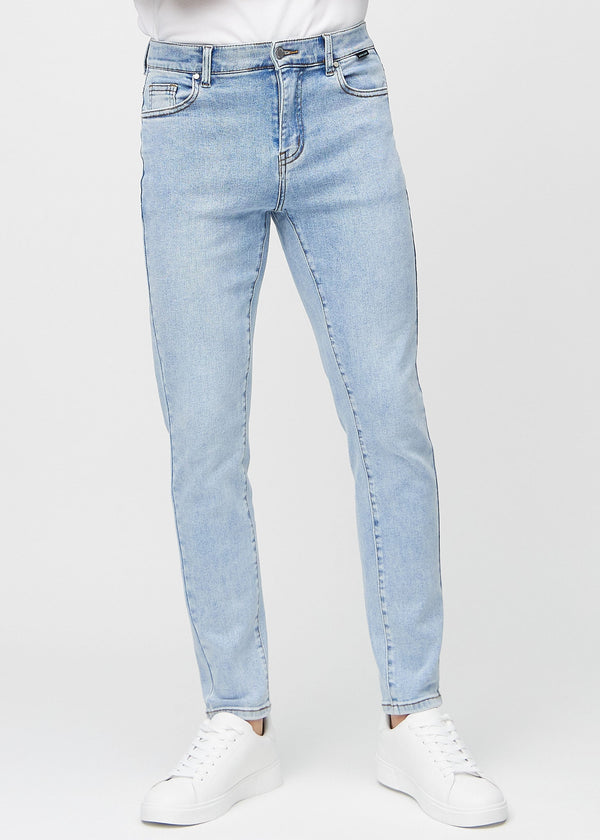 Light blue denim slim jeans, model name Waves, fitted closely along the legs , front view.