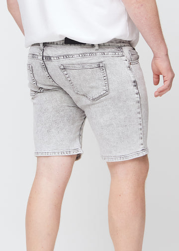 Light grey denim middle-regular shorts seen from the back close up on a plus-size model to show details.